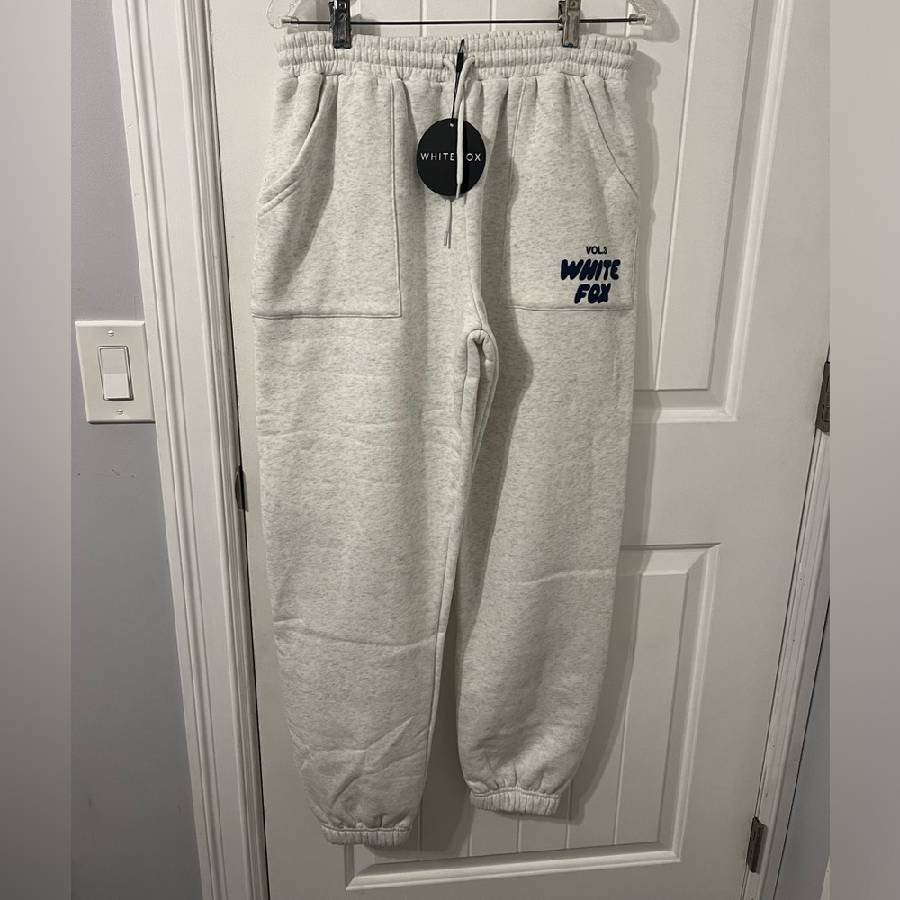 White fox vol. 3 light gray joggers with navy blue wording
